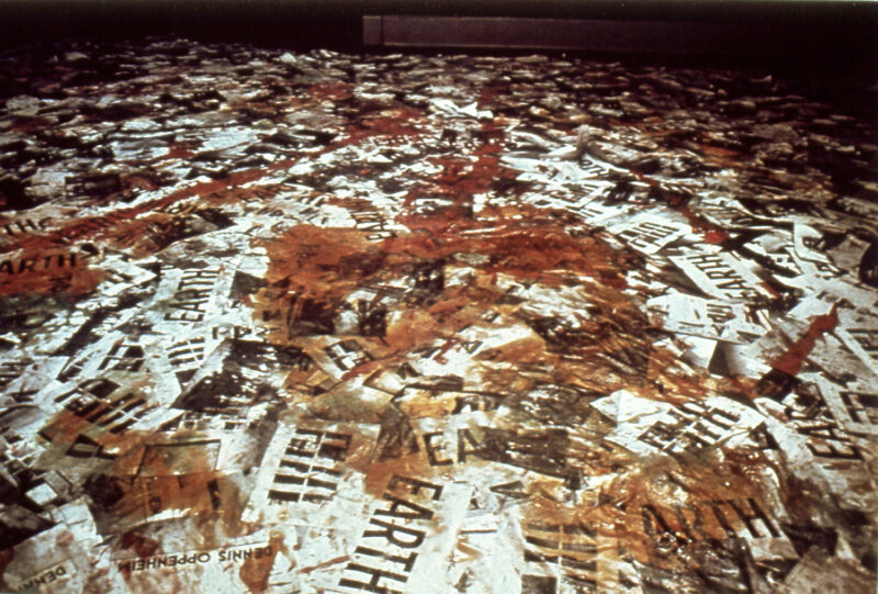 Les Levine "Systems Burnoff x Residual Software," 1969 Installation view Chicago, 1969 1,000 copies each of 31 photographs taken at the March 1969 opening of "Earth Art" at Andrew Dickson White Museum of Art, Ithaca, NY, Jell-O poured on the photographs, and chewing gum attached photos to the wall. Photo:  courtesy of the artist