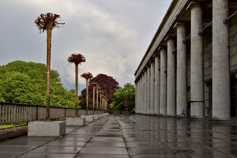 Gustav Metzger “Strampelde Bäumf"/Mirror Trees, installation view with trees overturned headfirst at the terrace of Haus der Kunst, 2010 photo: Marino Solokhov